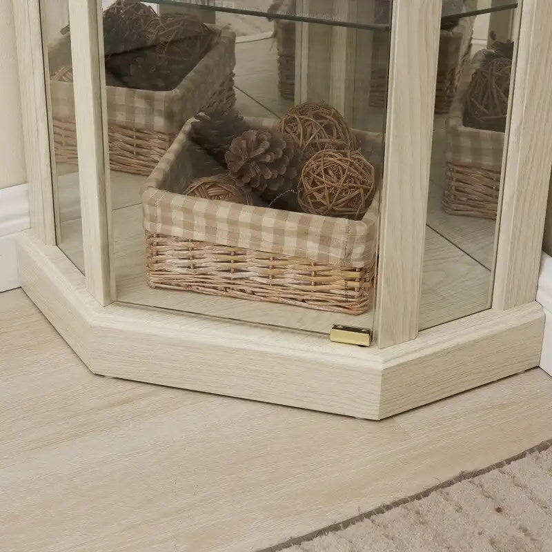 Meuble d'angle blanc avec portes vitrées et éclairage intégré, montage par 1 personne